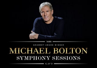 Michael Bolton sits arms-crossed on a black background on top of the logo for his tour that reads "Grammy-award Winner Michael Bolton - Symphony Sessions" in white and gold colors.